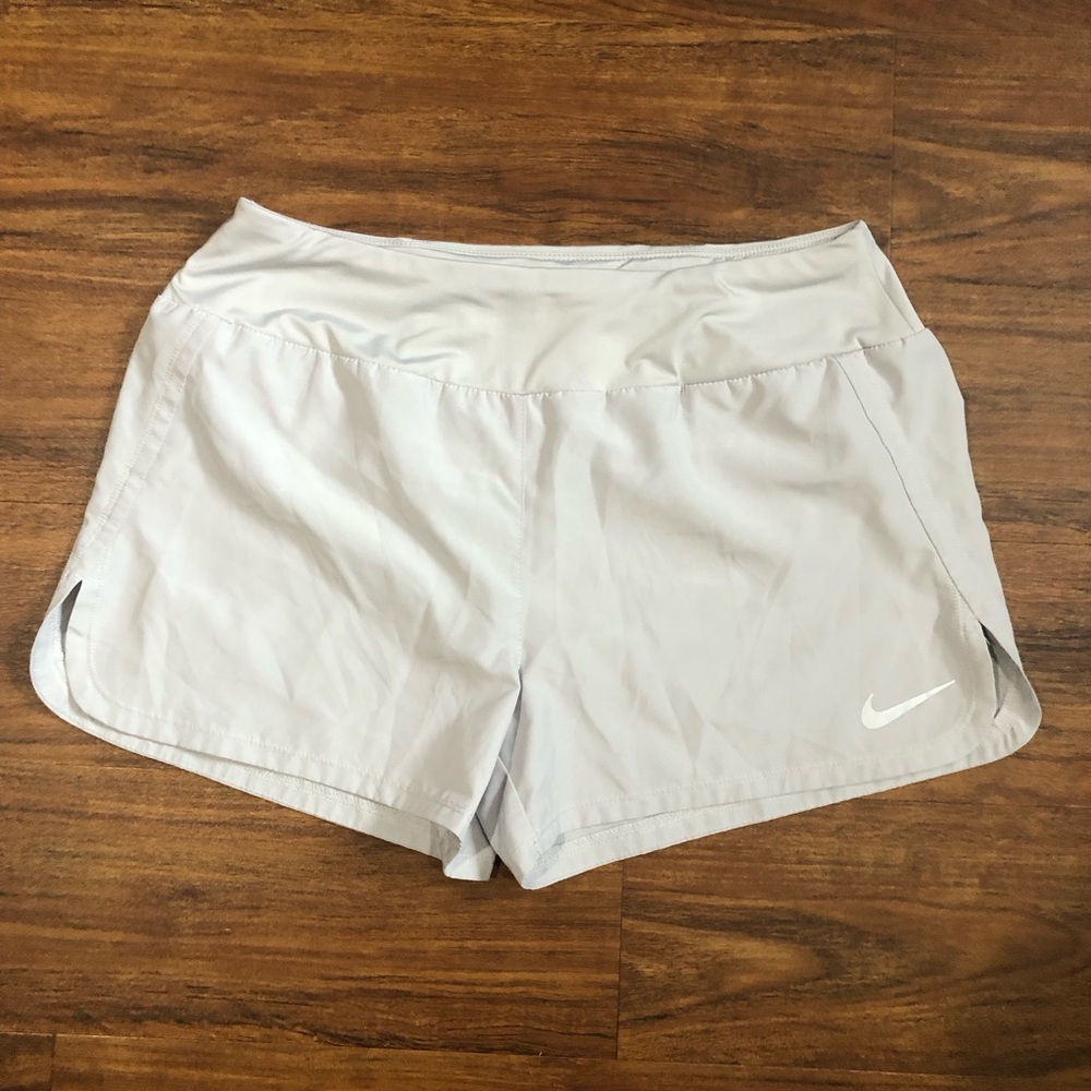 Nike Dri-Fit Women’s Light Silver Gray Athletic Shorts with White Swoosh